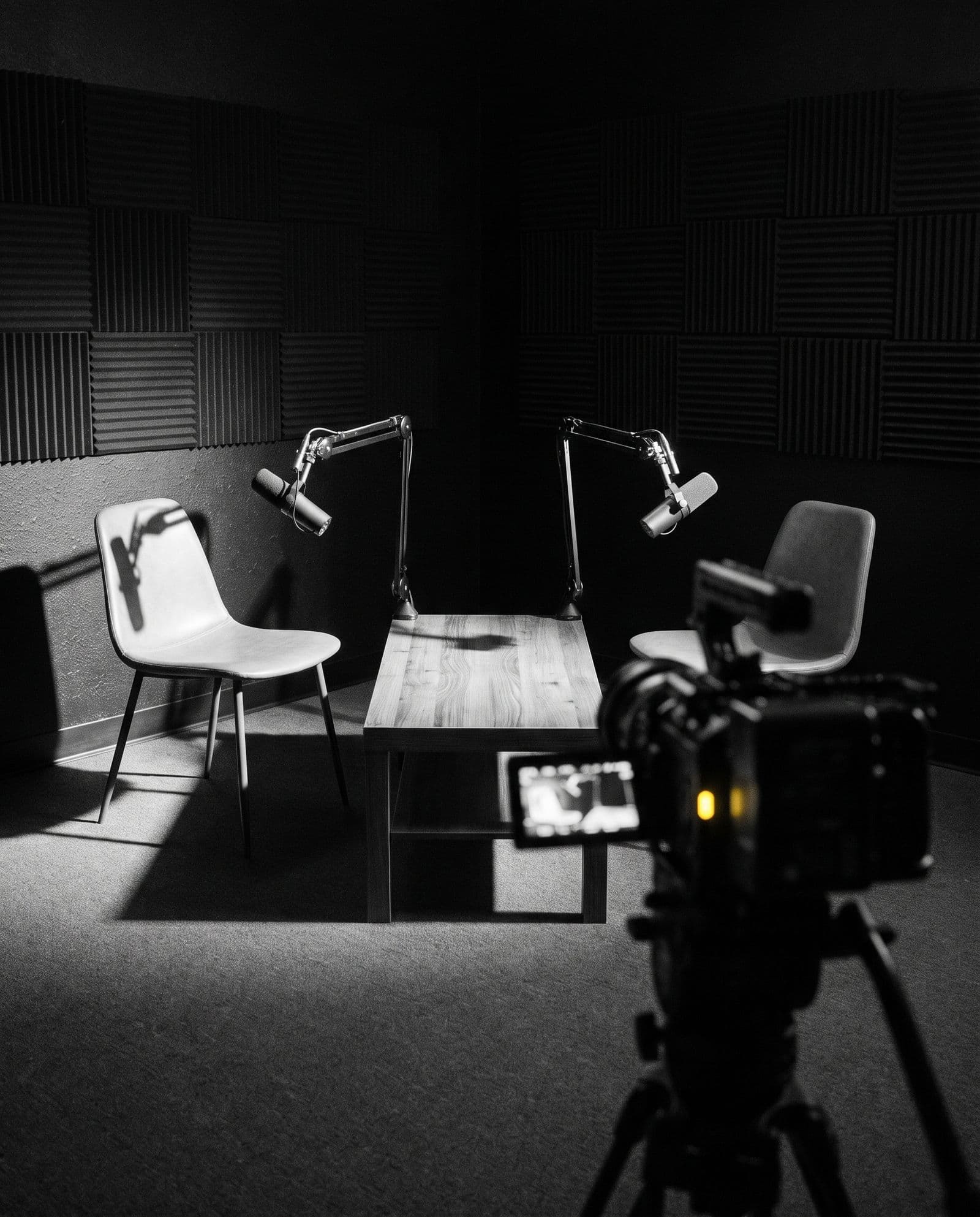 Illustration of a podcast set with the recording light on
